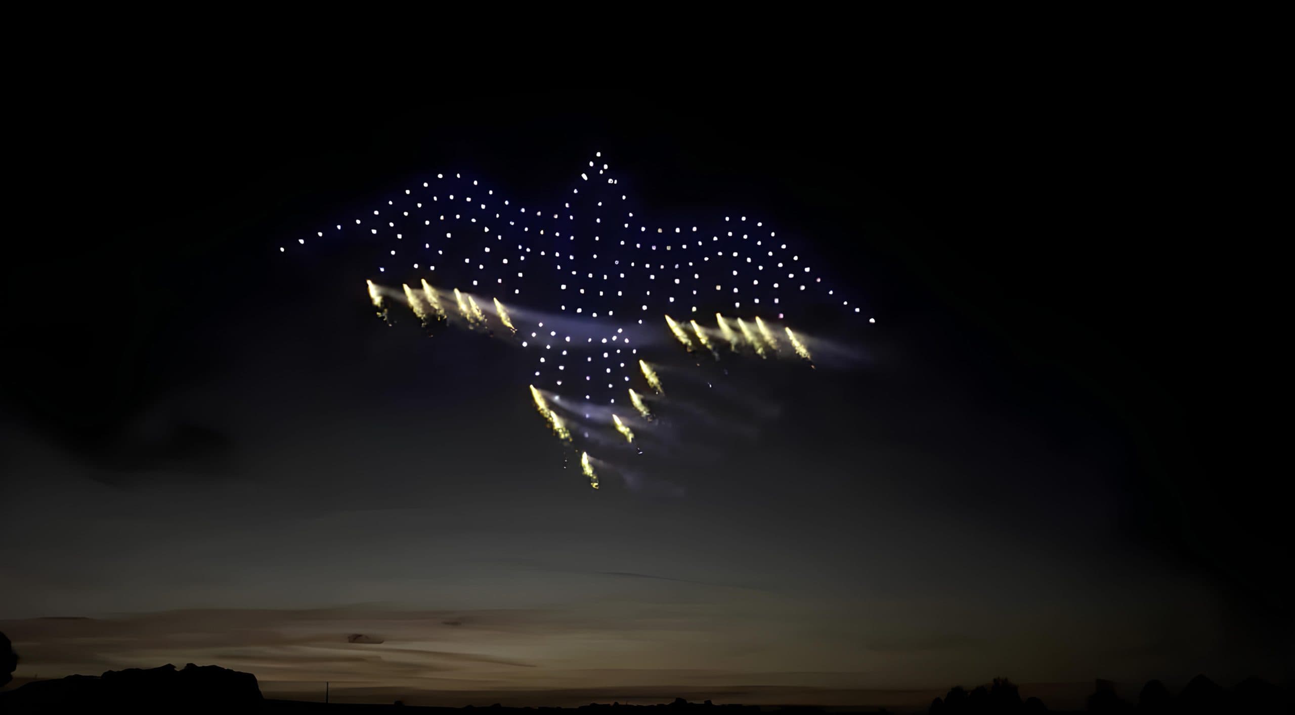 Outdoor drone and pyrotechnic display at a UK event venue